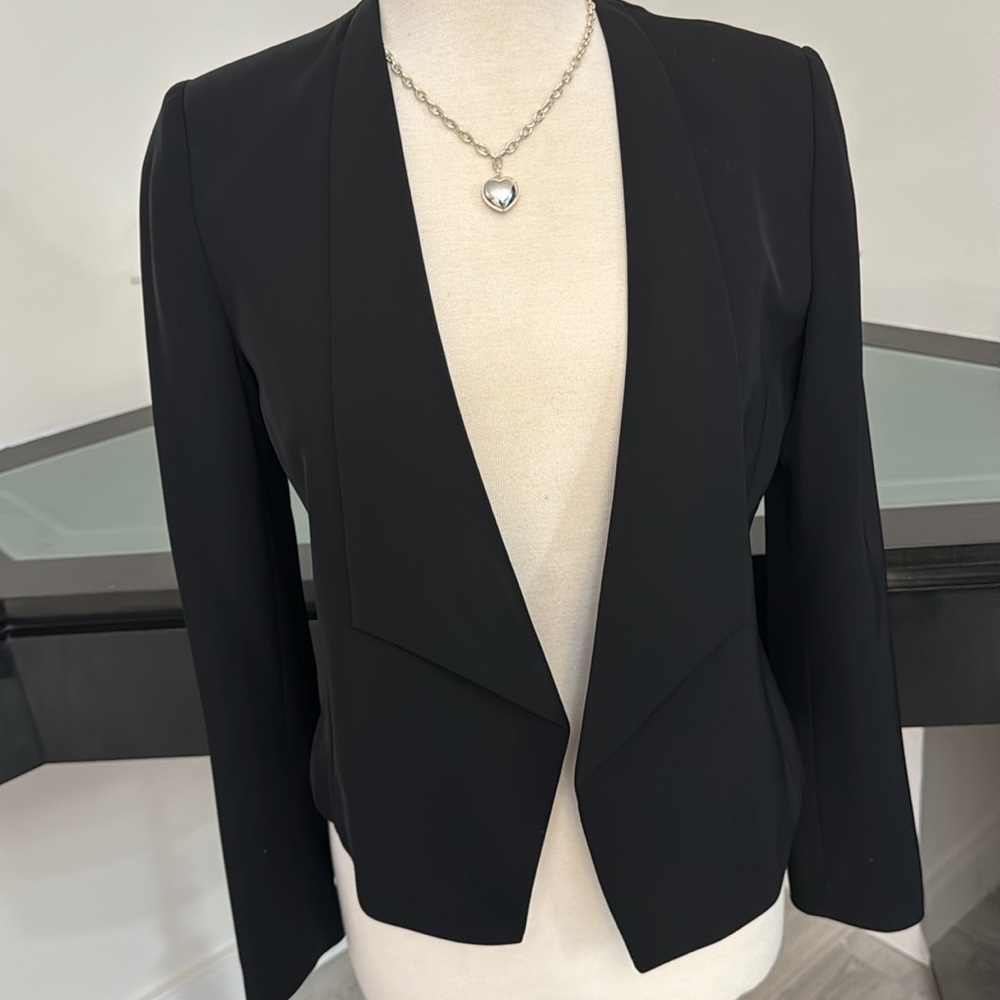 Calvin Klein in short jacket.